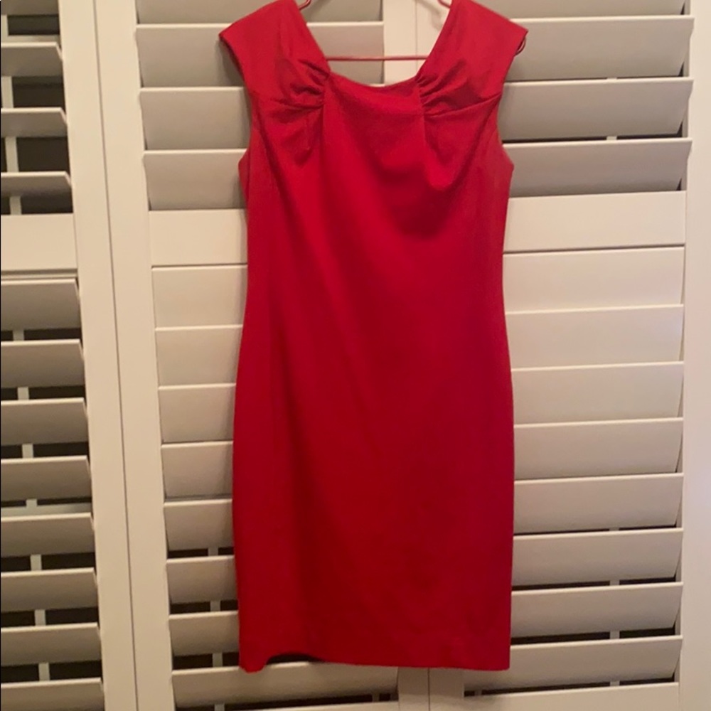 Calvin Klein red dress. Mid length. Zips in back